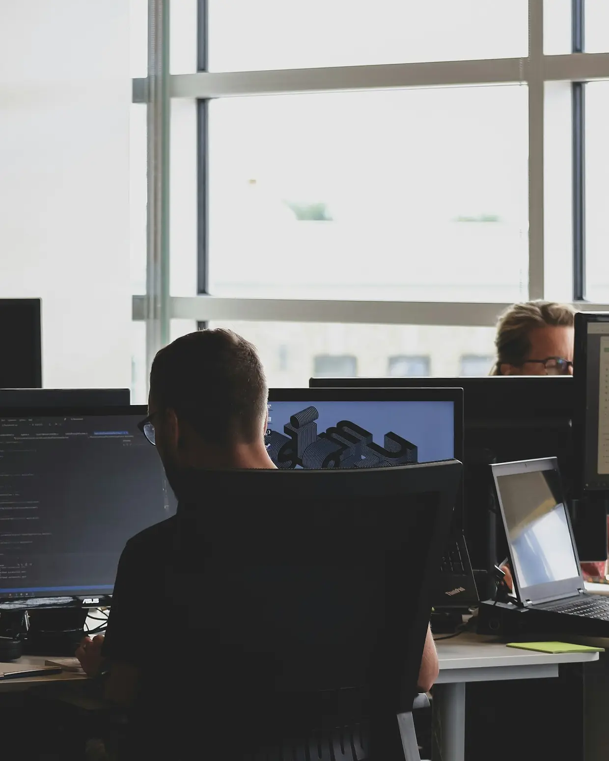 Cloud architect working at a desk