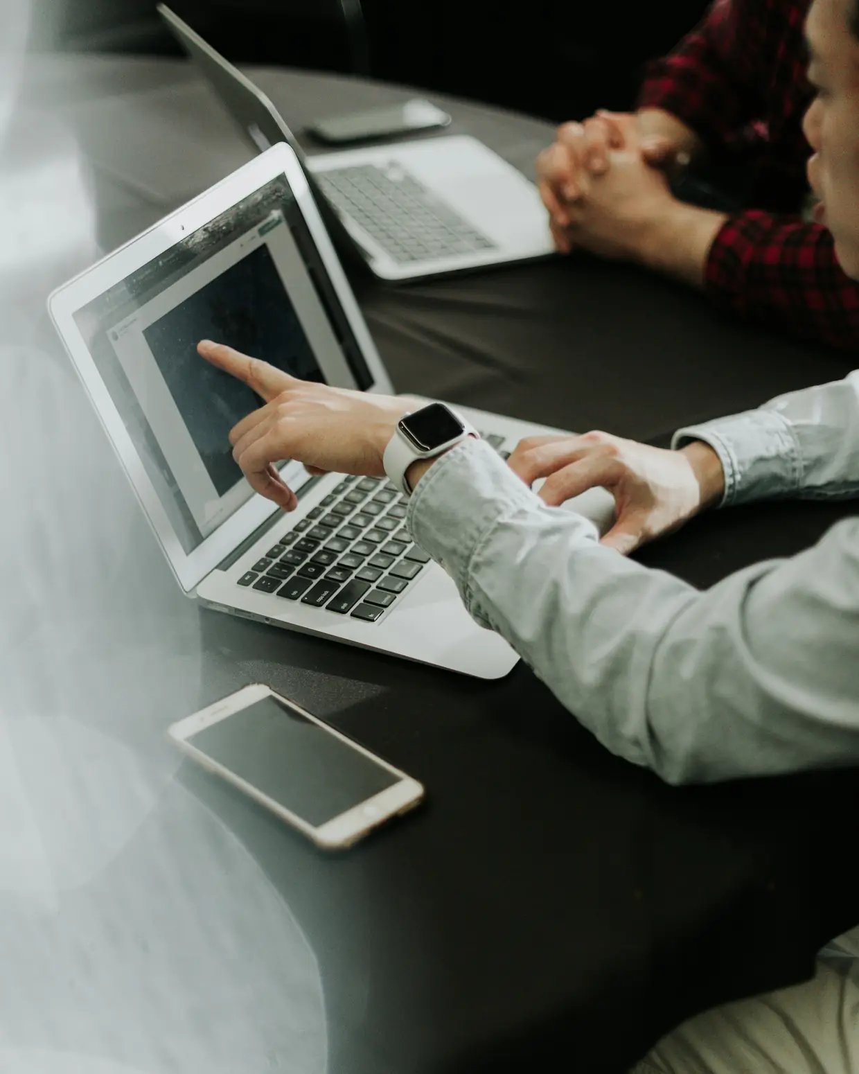 Startup founders working together on laptops