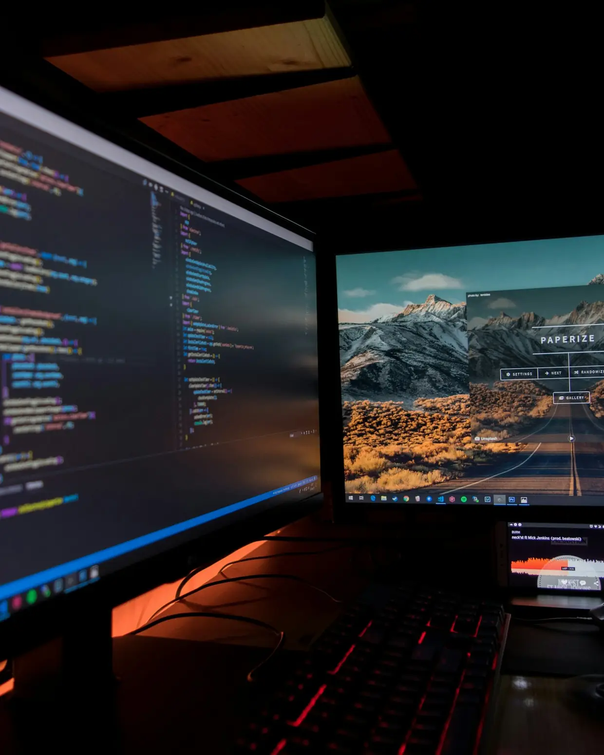 Developer working at a dual-monitor workstation