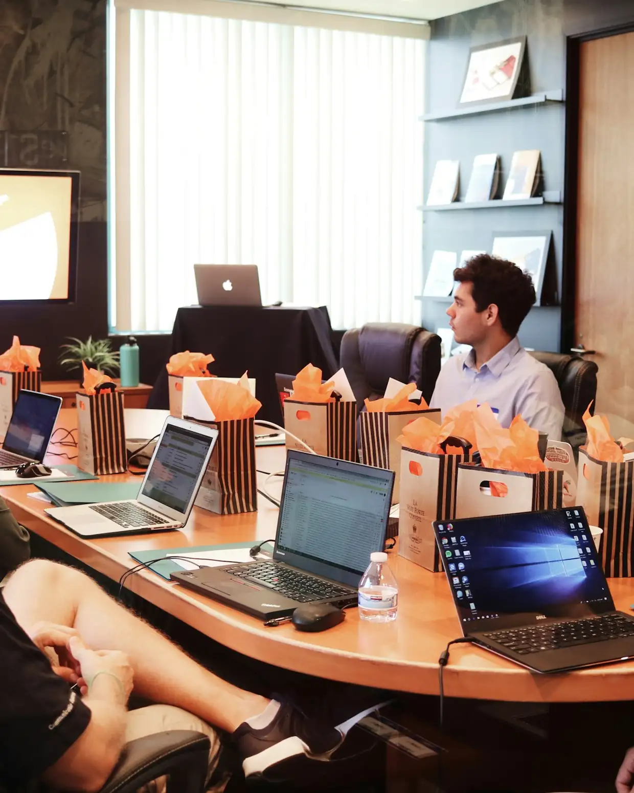 Product team meeting around laptops